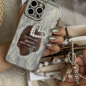 قاب موبایل آیفون قلب رمانتیک آیینه ای نگین دار + بندست