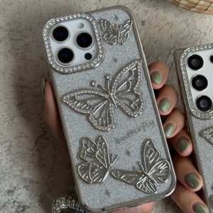 قاب موبایل ( آیفون - سامسونگ ) پروانه آموره نگین دار برجسته شاینی + بندست